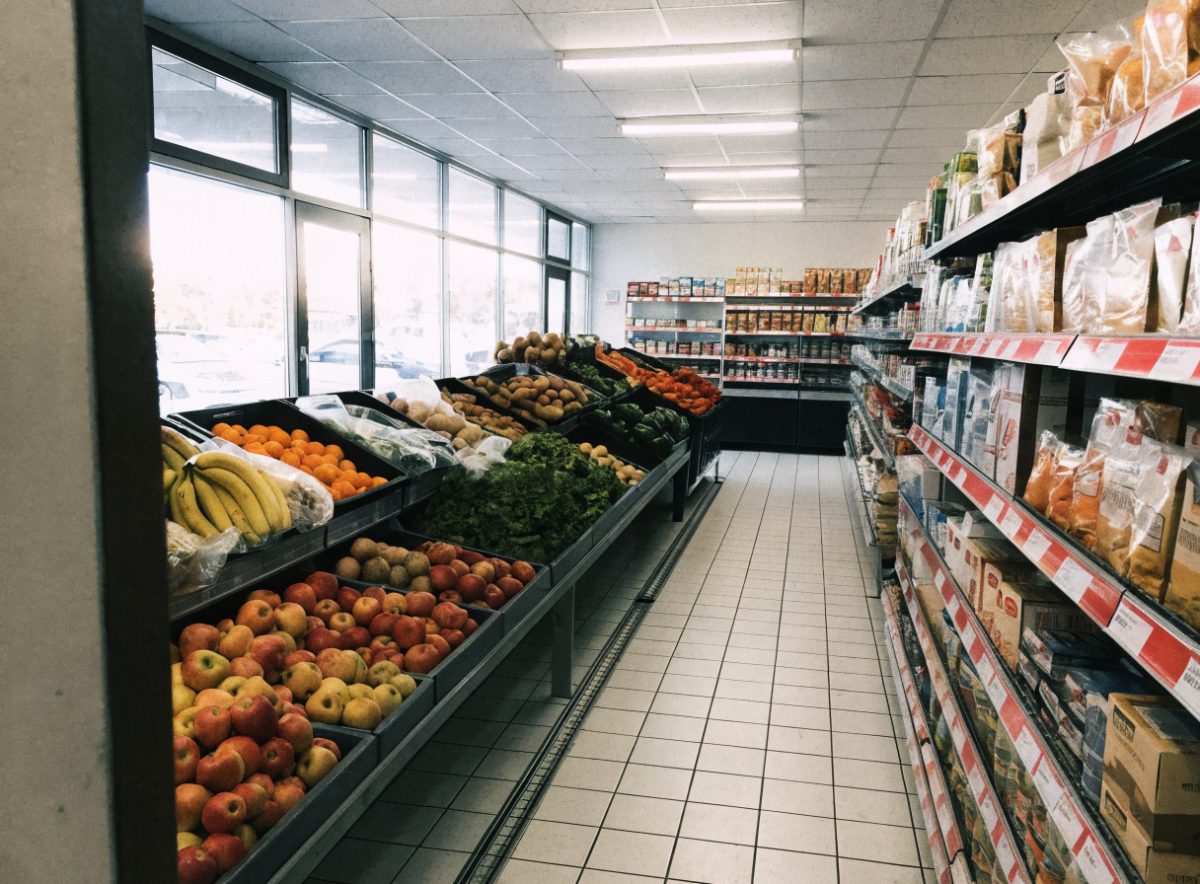 Fresh produce and stocked aisles inside E&A Grocery